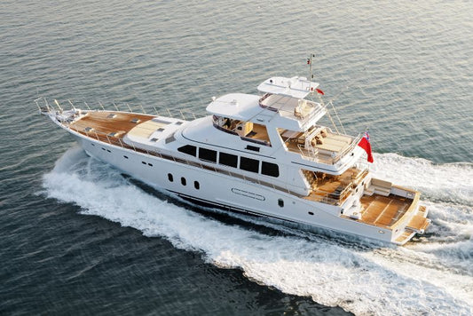 Crew using two-way radios aboard a luxury superyacht at sea.