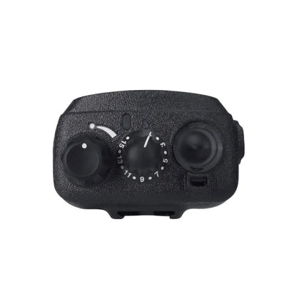 A close-up of a black textured camera lens protector cover with two circular openings and a central focus adjustment dial, shown on a plain white background.